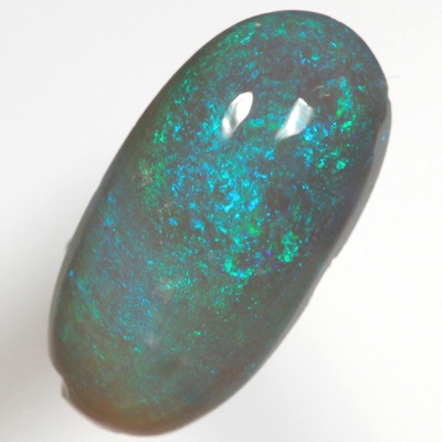 SOLID SEMI BLACK OPAL Sparkles of green over blue, high dome